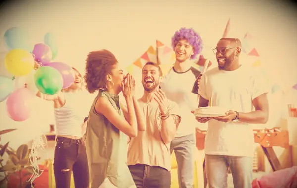 Friends having fun at the party of a woman who is having her birthday celebration.