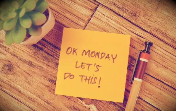 A post-it on a table saying: OK Monday, let